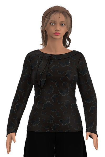 Långärmad tröja med båthals och knyt krage, tröjan har tajt passform och längd till under höftben i mörkbrunt tyg med svarta fjärilar med vita prickar från märket Esther & Inez